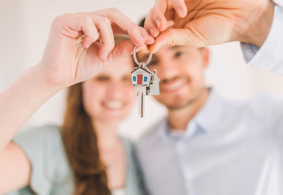Happy couple holding house keys
